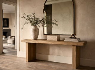 Ultra luxe home decor with minimalistic home decor design. A console table with a vase and some greenery, a decor box & some books