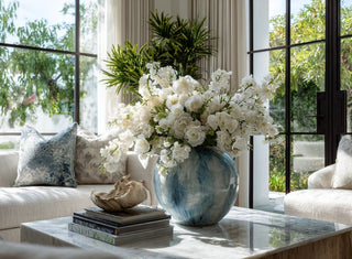 Realistic faux flower arrangement in bright room.