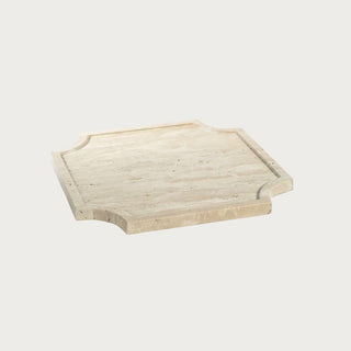 10.25 Inch white travertine stone decorative tray with shaped corners, recessed center and natural cream and beige stone variation.