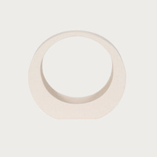 11-inch creamy white sand-glazed stoneware sculpture with an abstract circular opening, curved base and softly textured neutral finish.