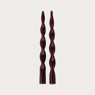 Set of two 12 Inch Burgundy Twisted Taper Candles shown without candle holders, featuring a sculptural spiral silhouette and deep burgundy finish.