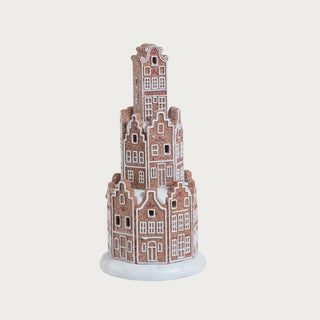 12-inch LED gingerbread house made of resin with white and gold detailing, glittered finish, and illuminated windows, photographed on a neutral background for elegant holiday décor styling.