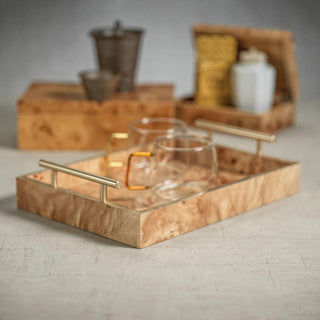 13-inch Leiden burl wood tray styled on a coffee table holding a candle and decor objects