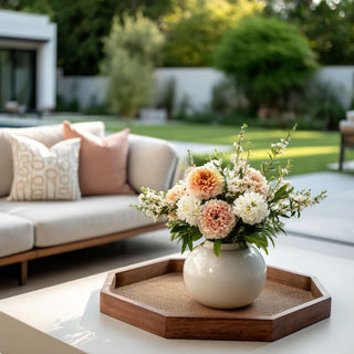 Octagonal_mango_wood_tray_with_rattan_cane_inlay steed on an outdoor coffee table with contemporary decor style furniture