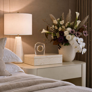 16.25 Inch Pearl Capiz Shell Decorative Box styled on a bedroom nightstand with a crystal glass faced clock, ivory lamp and floral arrangement.