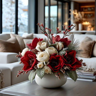 Red Velvet and mixed Floral arrangement in a white vase on a coffee table in a living room.