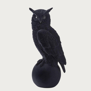 a black velvet owl sitting atop of a rounded black ball, perched, halloween decor, resin material, high end halloween decor
