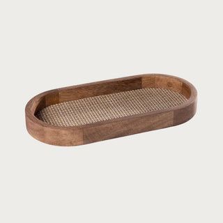hand crafted Oval mango wood tray with rattan inlay on neutral background