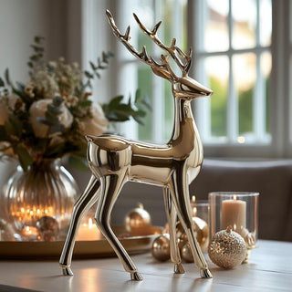 20.5-inch polished golden deer figurine displayed on holiday table surrounded by candles and ornaments – modern metallic reindeer décor for elegant home styling.