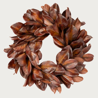 23-inch Bourbon Brown magnolia leaf wreath with layered Southern-inspired foliage in cognac, chestnut, mahogany, and amber-brown tones.