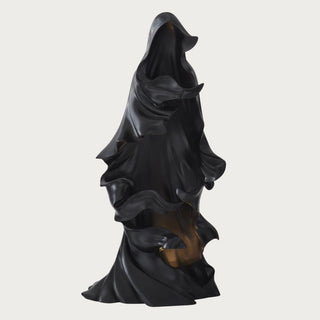 24.25 inch black draped LED ghost in matte resin with warm amber interior light for Halloween decor.