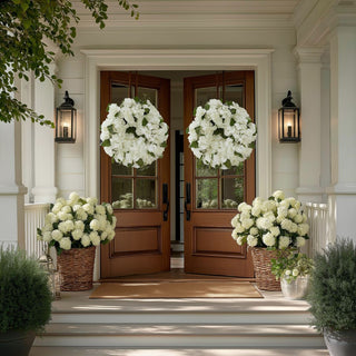 Two identical True Bloom white hydrangea wreath with full realistic faux blooms and layered petal texture, styled as a refined decorative accent hanging on a front door entryway 