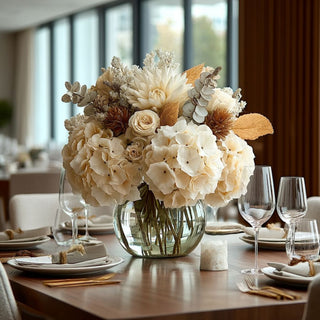 27.5 styled light cream faux hydrangea stem in a round vase with other fall inspired florals on the table in a luxury decor style dining room 