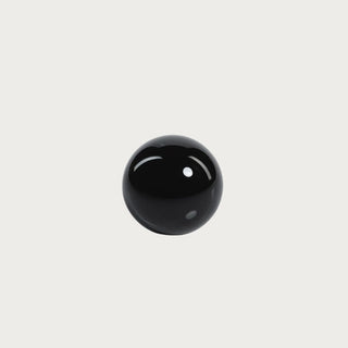 Single 3.25-inch round black crystal glass decorative ball with a smooth high-gloss polished finish.