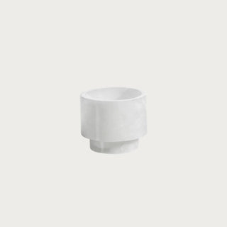3.75-inch polished alabaster condiment and candle holder with creamy white natural stone variation, cylindrical sides, and a raised base.