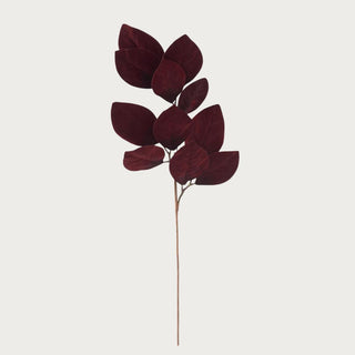 33-inch burgundy velvet magnolia leaf spray featuring deep red velvet leaves with natural branching and soft matte sheen, photographed against a neutral background for refined winter décor styling