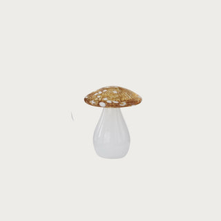 Small 5.5-inch decorative glass mushroom with a translucent amber-gold speckled cap and glossy white glass base.