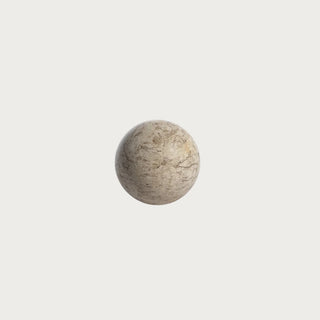 Large 5-inch natural travertine stone decorative orb with warm neutral coloring, organic veining, pores, and naturally varied mineral markings.