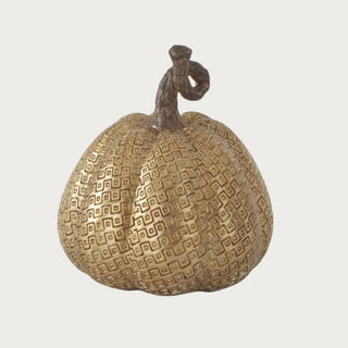 5.25 inch gold resin pumpkin with raised geometric embossed pattern and dark brown sculpted stem for fall tabletop, shelf and console decor.