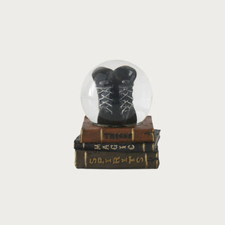 5.5" snow globe with witch boots on a stack of books for halloween/fall decor 
