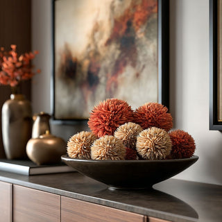5" Styled Burnt Orange Allium Ball mixed with matching cream allium balls in a decorative bowl on a luxury console table with complementary fall home decor items