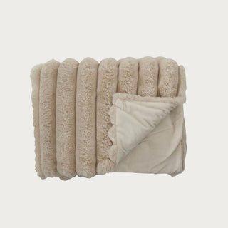 60 Inch Light brown faux fur throw blanket folded neatly, showing ribbed texture and smooth underside. 