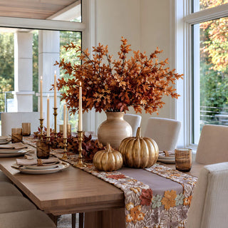 68 inch embroidered fall leaves table runner styled on a dining table with autumn florals, brass candlesticks and seasonal decor for a fall or Thanksgiving tablescape.