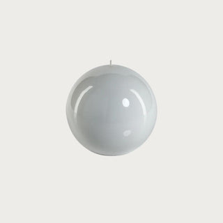 6-inch round white lacquer ball candle made of premium wax with a smooth, high-gloss finish, photographed on a neutral background for modern home décor styling. This minimalist white decorative candle adds timeless elegance, sculptural interest, and contemporary sophistication to tabletops, sideboards, or seasonal displays.