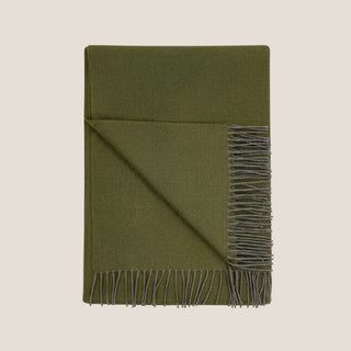 Folded 70-inch olive green 100% baby alpaca throw blanket with contrasting gray fringe.