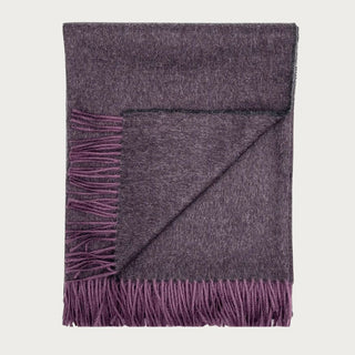 Folded 71 Inch Elderberry 100% baby alpaca throw blanket showing its soft plum-purple weave, tonal variation, and fringed edge.