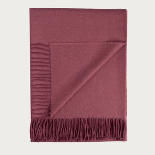 71 Inch Malbec 100% Baby Alpaca Throw Blanket in a muted wine red and burgundy tone with soft woven texture and fringed ends.