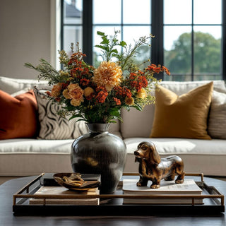 7" Bronze cast aluminum dachshund /dog sculpture on neutral background styled on a tray on  coffee table with nice decor