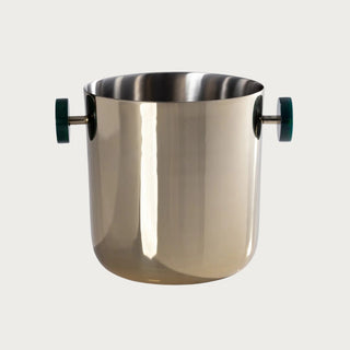 8.25-inch polished gold ice bucket with green resin handles and reflective high-shine finish, photographed against a neutral background for elegant home entertaining and modern barware styling.