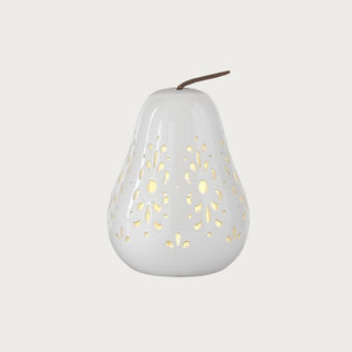 White ceramic cutout LED pear with illuminated design, shown as a sculptural decorative accent