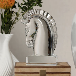 9.25 inch clear crystal horse head sculpture with sculpted mane on a rectangular crystal base, styled on a wood box beside a white vase and greenery.