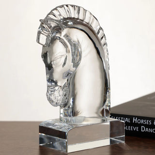 Clear crystal horse head sculpture in three-quarter side view showing the sculpted face, ridged mane, transparent body, and rectangular crystal base.