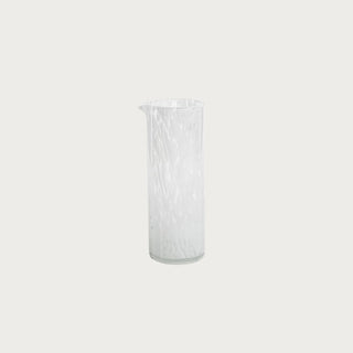 White and clear hand-blown glass vase with subtle swirl design. 9.5” tall—perfect as a summer centerpiece or accent vase.