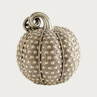 9.75 inch antique gold resin decorative pumpkin with raised medallion texture, twisted rib detailing and sculptural curled stem.