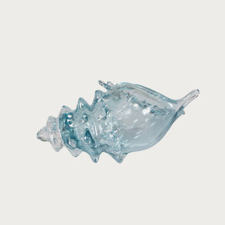 Long profile view of the Aqua Lagoon Glass Seashell with translucent blue glass, sculptural seashell shape, and textured ridges for spring and summer coastal decor.