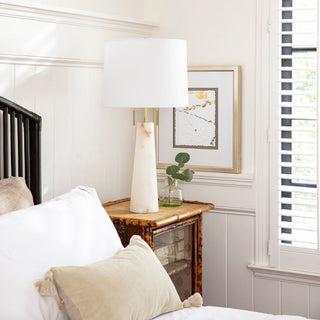Luxury alabaster stone table lamp featuring a sleek conical silhouette, natural brass finish, and crisp white shade for elegant lighting. Home Decor, Third & Main, alabaster table lamp, modern table lamp, alabaster stone lighting, brass table lamp, bedside lighting, contemporary lamp, Luxury decor