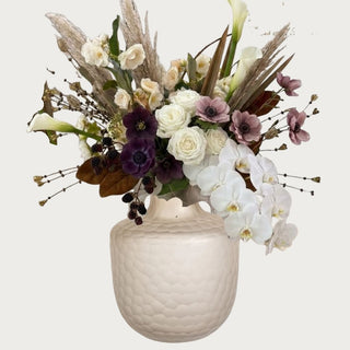 Autumn Champagne Floral Bundle shown with creamy Real Touch orchids, champagne calla lilies, plum ranunculus, eggplant anemones, blackberry stems, pampas, and magnolia leaves.