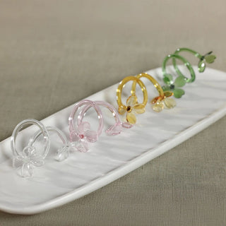 glass floral napkin rings set in clear pink yellow and green with keepsake storage box for elegant entertaining and table decor
