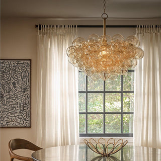 Amber bubble glass chandelier with hand-blown spheres and natural brass finish, modern statement lighting for dining room or living space. Home Decor, Third & Main, Regina Andrews Lighting, Luxury Lighting, Contemporary Lighting, Fall Decor