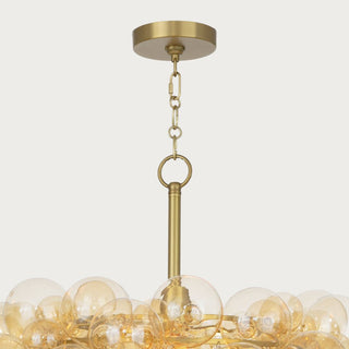 Contemporary chandelier featuring round amber glass bubbles clustered on a brass frame, elegant ceiling light fixture for modern interiors. Home Decor, Third & Main, Regina Andrews Lighting, Luxury Lighting, Contemporary Lighting, Fall Decor