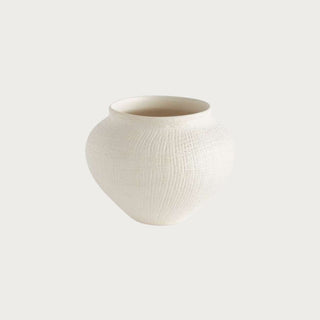 Matte white ceramic Butera pot with crosshatch texture, handcrafted with a matte finish. Perfect for faux florals or as a sculptural accent on shelves or tables.
