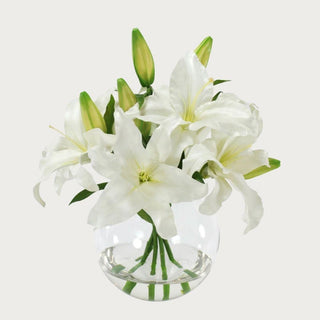 Casablanca lily faux floral arrangement with realistic faux water in a clear glass vase, perfect for spring home décor and elevated entryway styling with a quiet luxury aesthetic.