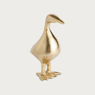 Gold cast aluminum duck sculpture with textured finish and sculptural silhouette, styled as an elegant decorative accent