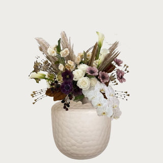 Autumn Champagne Floral Bundle shown with creamy Real Touch orchids, champagne calla lilies, plum ranunculus, eggplant anemones, blackberry stems, pampas, and magnolia lea
