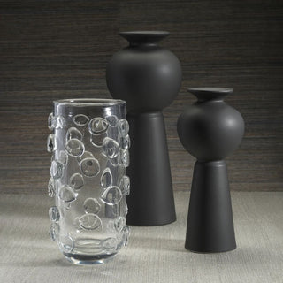 11.75 inch Clear Celeste Tall Vase/Hurricane styled with matte black vases, featuring clear glass and raised circular detail for year-round decor.
