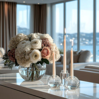 Clear Round Crystal Taper Candleholder and beautiful floral arrangement Styled on a luxury console table of a luxury modern home 